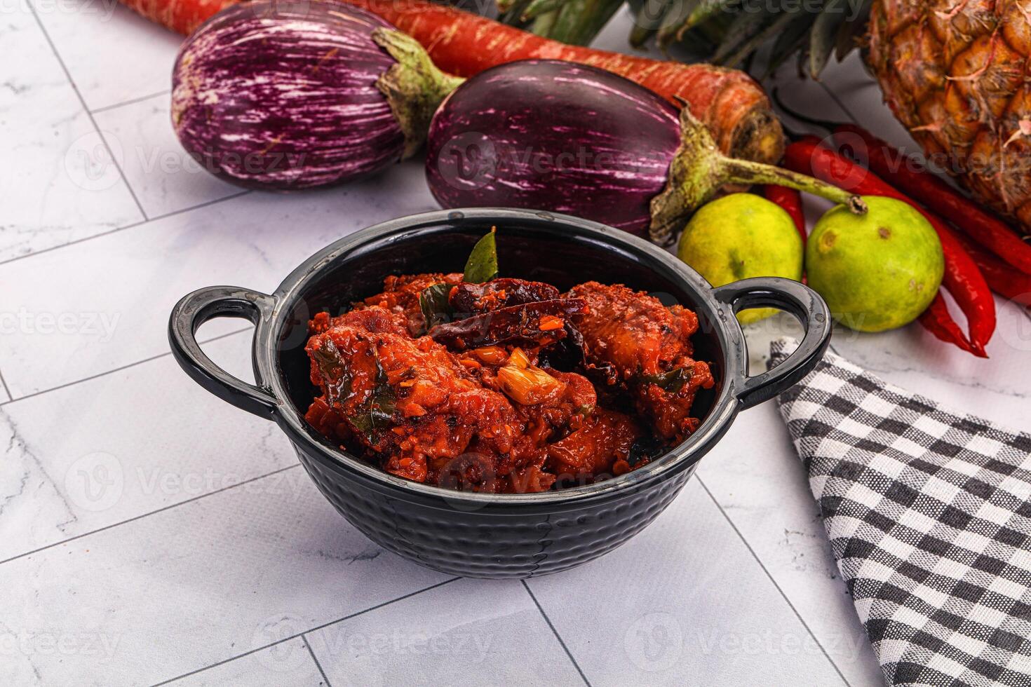 A bowl of food with vegetables and other ingredients photo