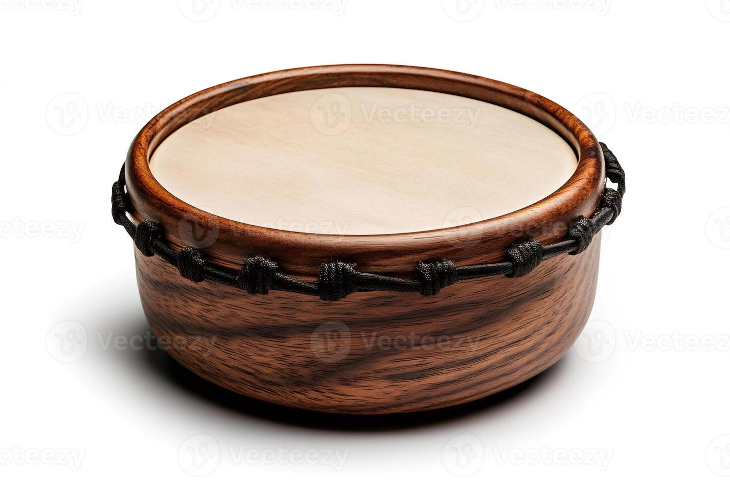 Bodhran drum resting on white background showing wooden frame and tightly laced skin photo