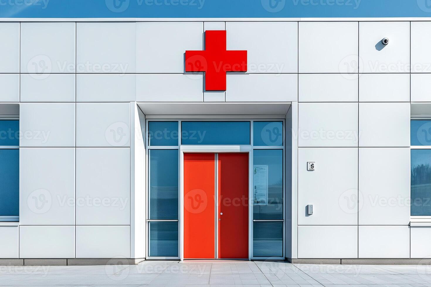 Red cross sign and red door identifying medical facility building photo