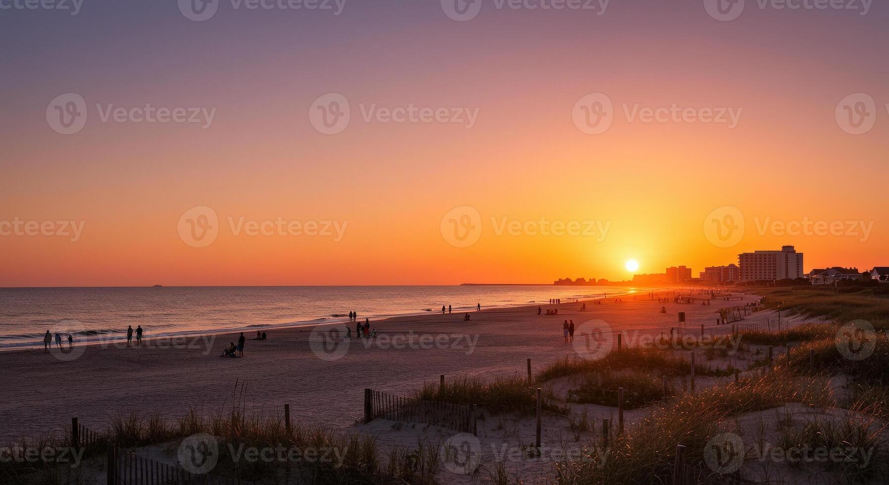 A beautiful sunset over the ocean and beach photo