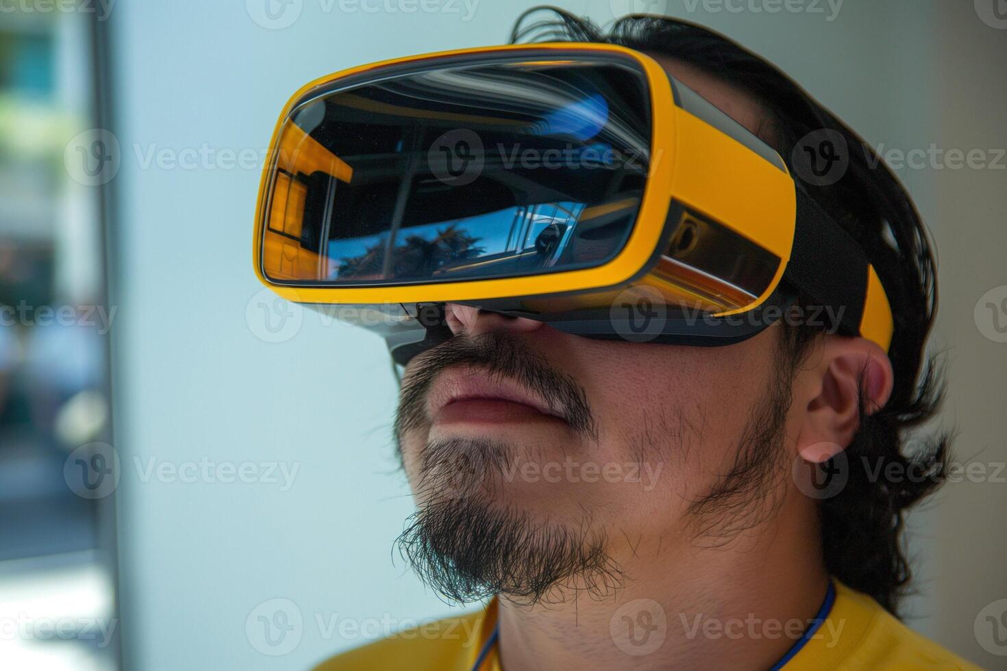 A Hispanic male using virtual reality goggles, immersed in a digital experience in a modern environment. photo