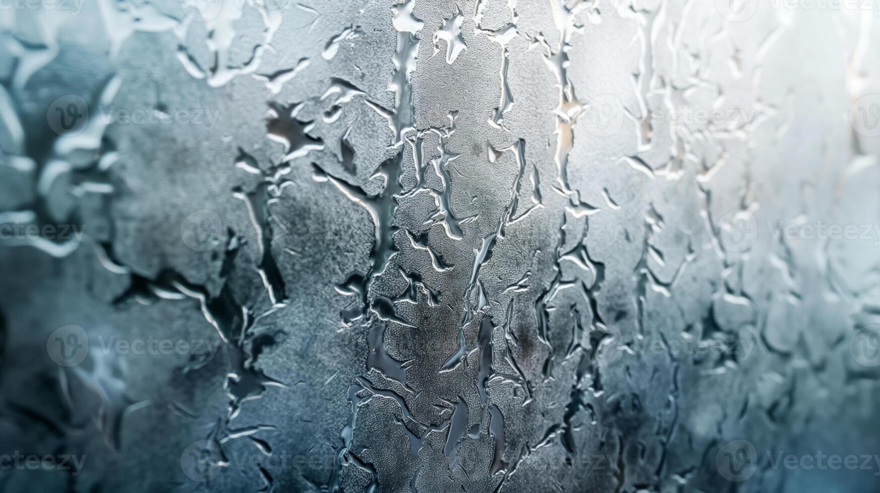 Close-up of intricate frost patterns on a glass surface, creating a beautiful abstract design. photo