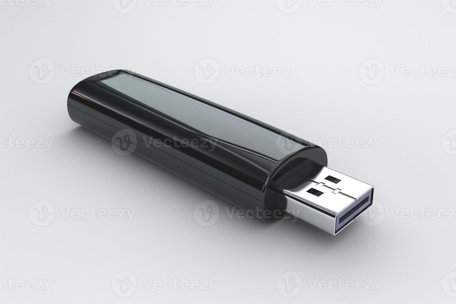 A sleek black USB flash drive lying on a smooth surface, showcasing its modern design and utility. photo