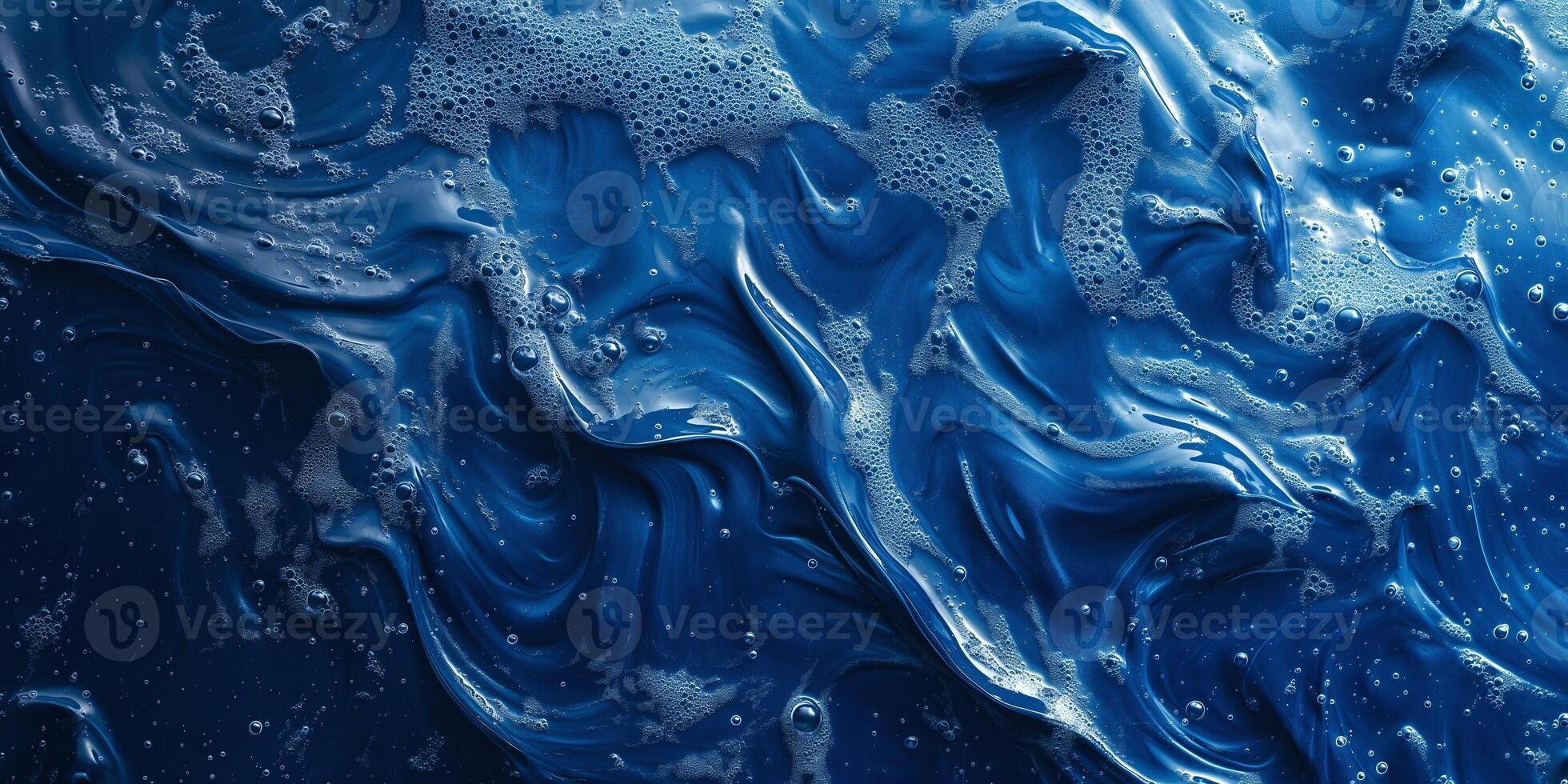 A captivating abstract ocean-like pattern of deep blue with swirling bubbles and foam. photo
