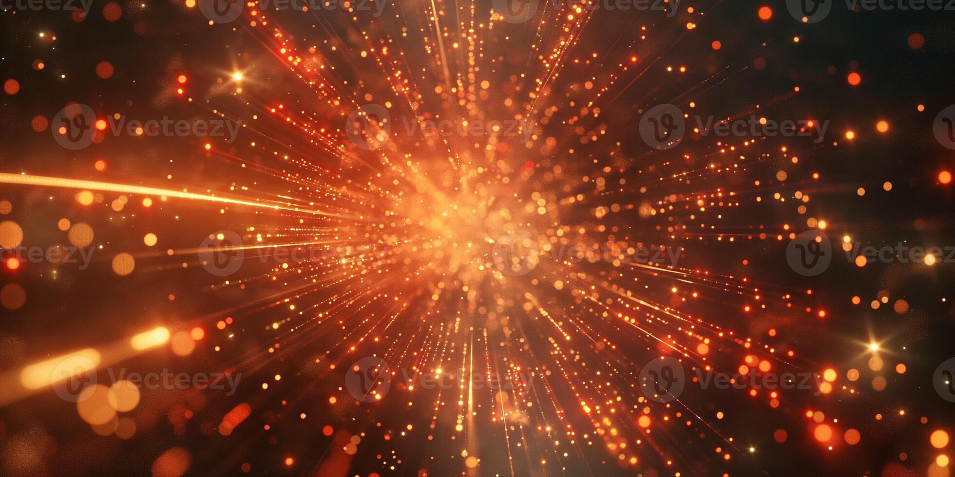 Vibrant abstract image of glowing particles radiating outward in warm shades of orange and gold. photo