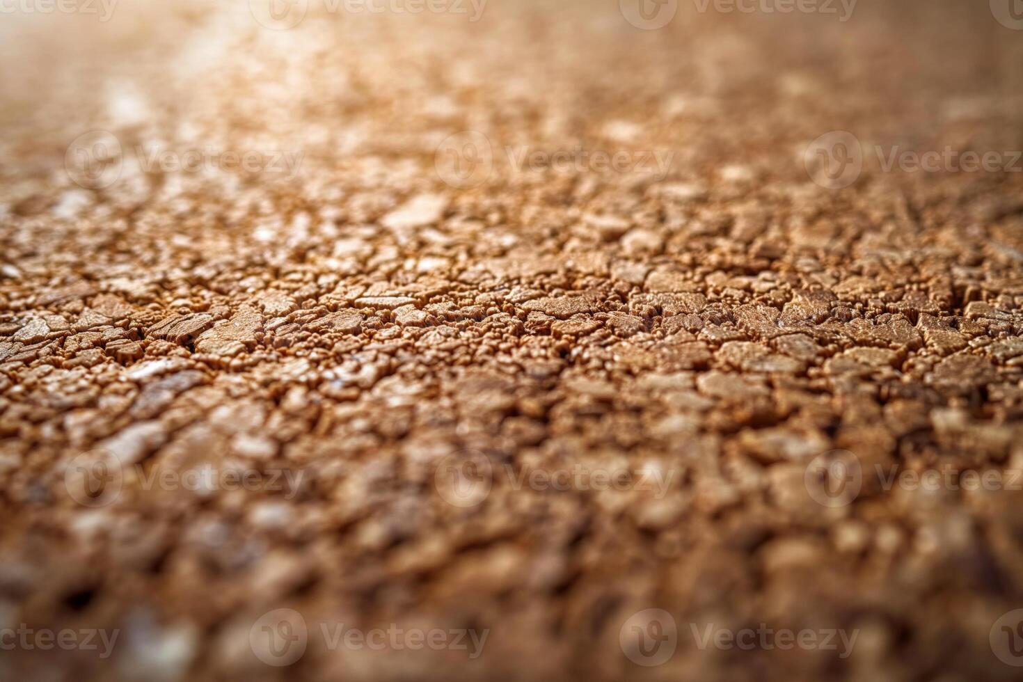 Close-up of textured brown surface showcasing intricate patterns and details. photo