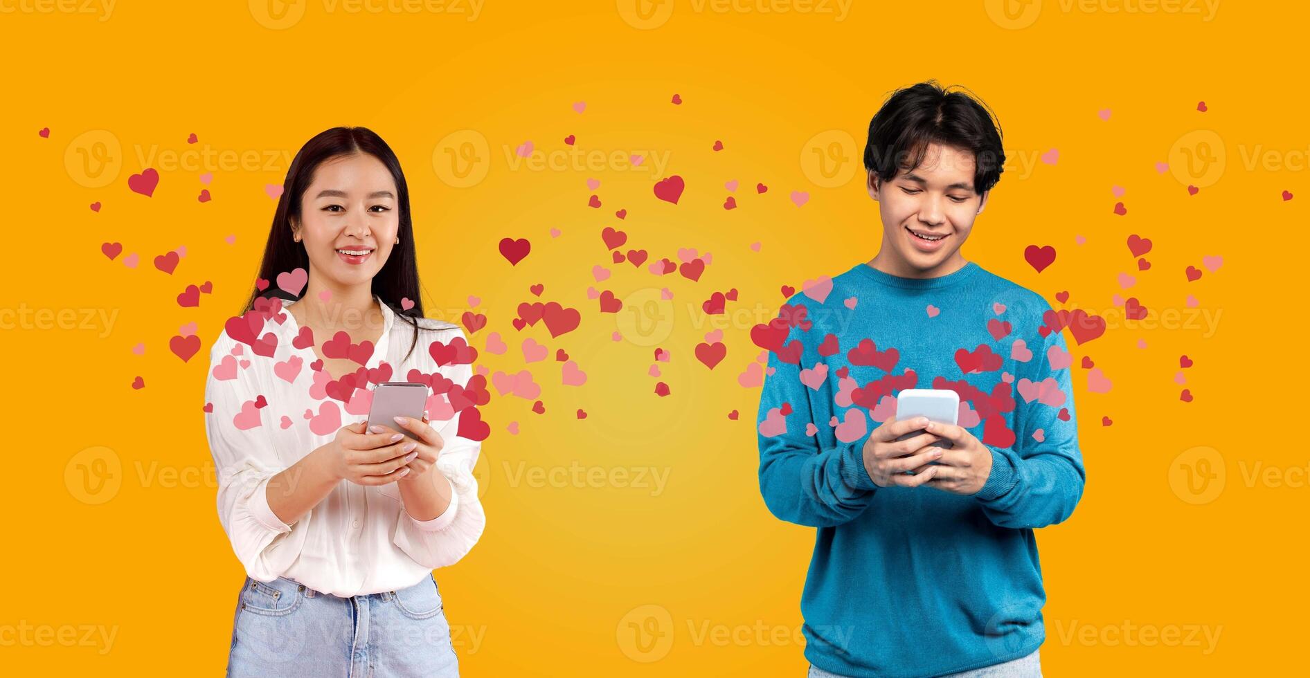 A couple celebrates St. Valentine's Day, smiling and exchanging affectionate messages on their smartphones. Their joy is highlighted by heart graphics, creating a festive atmosphere. photo