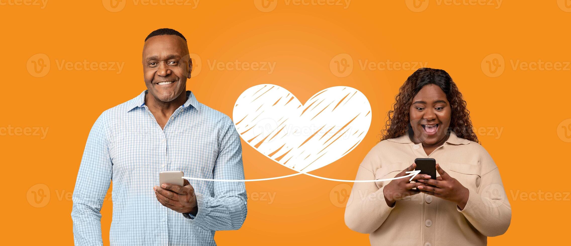 A couple expresses their affection on St. Valentines Day, connecting online through smartphone messages. Their joyful interaction illustrates modern love and celebration. photo