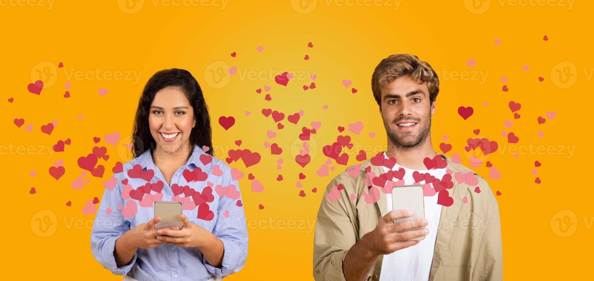 A couple shares affectionate moments on St. Valentine's Day, using their smartphones to send loving messages. Hearts float around them, highlighting their celebration of love together. photo