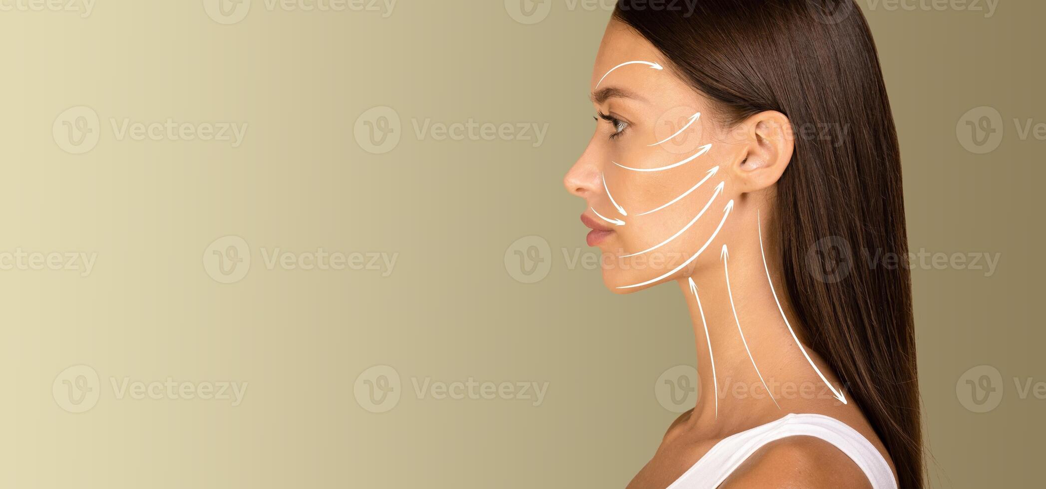 A woman enjoys a soothing skin care session, receiving a gentle facial massage designed for anti-aging and rejuvenation. Soft lighting enhances the relaxing atmosphere of the experience, copy space photo