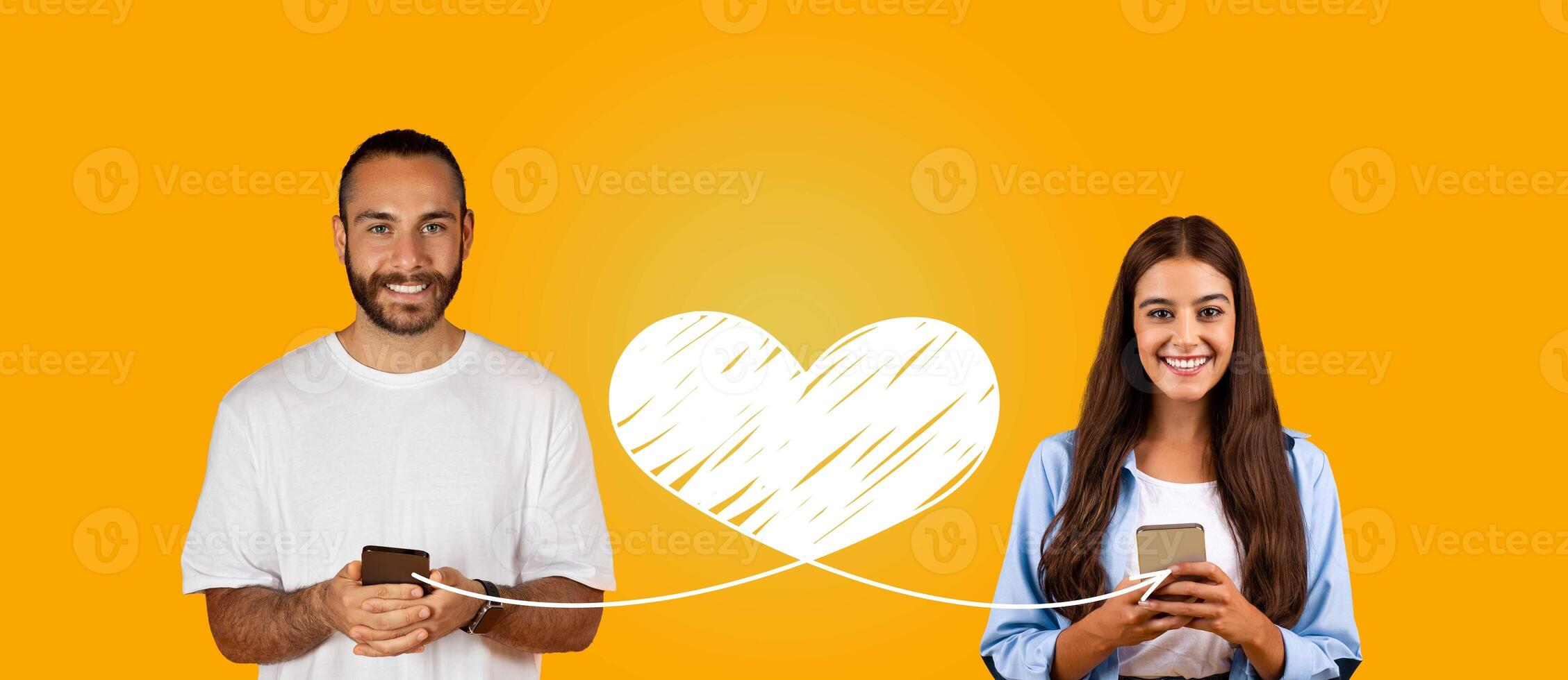 In a joyful celebration of St. Valentine's Day, a couple shares affectionate messages through their smartphones. They are connected by a heart symbol, showcasing their love online. photo