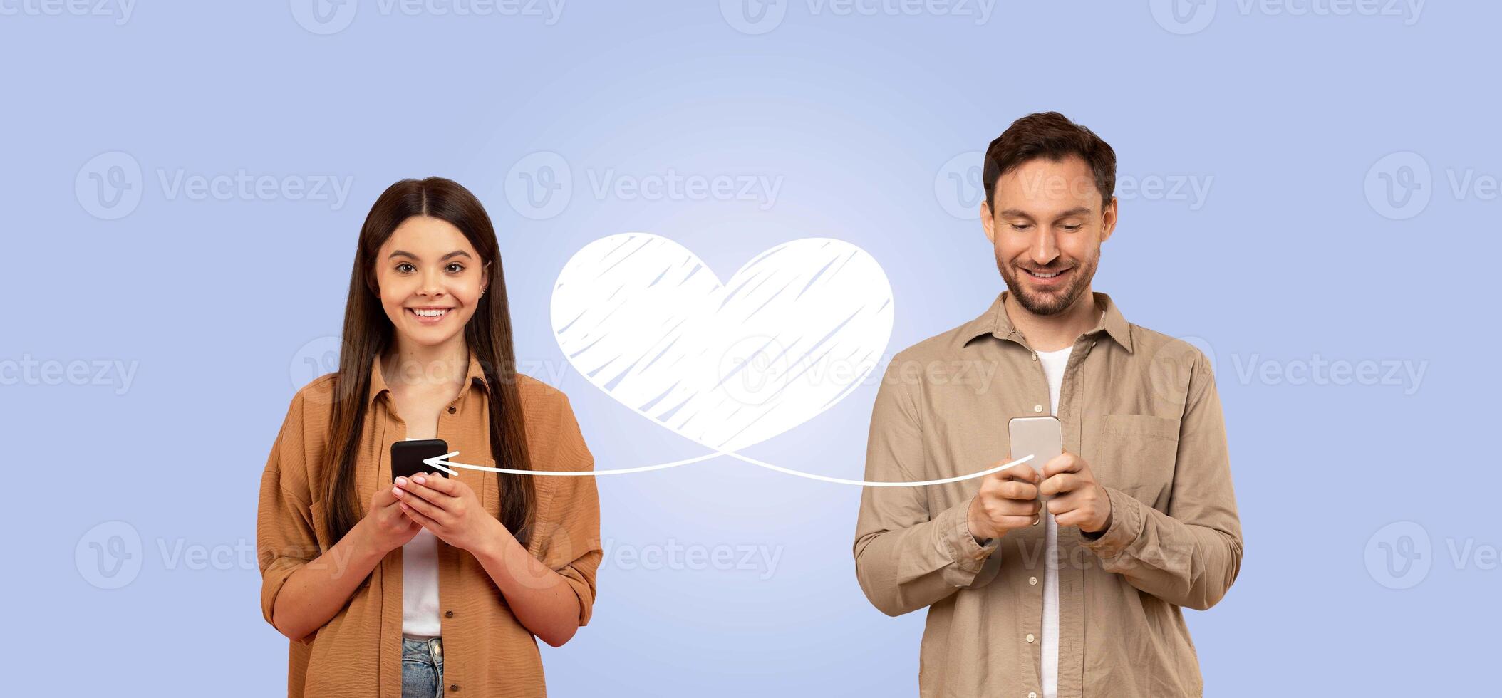 A couple stands together isolated in a collage, smiling while engaged with their smartphones. They are sending affectionate messages to each other, celebrating love on St. Valentine's Day. photo