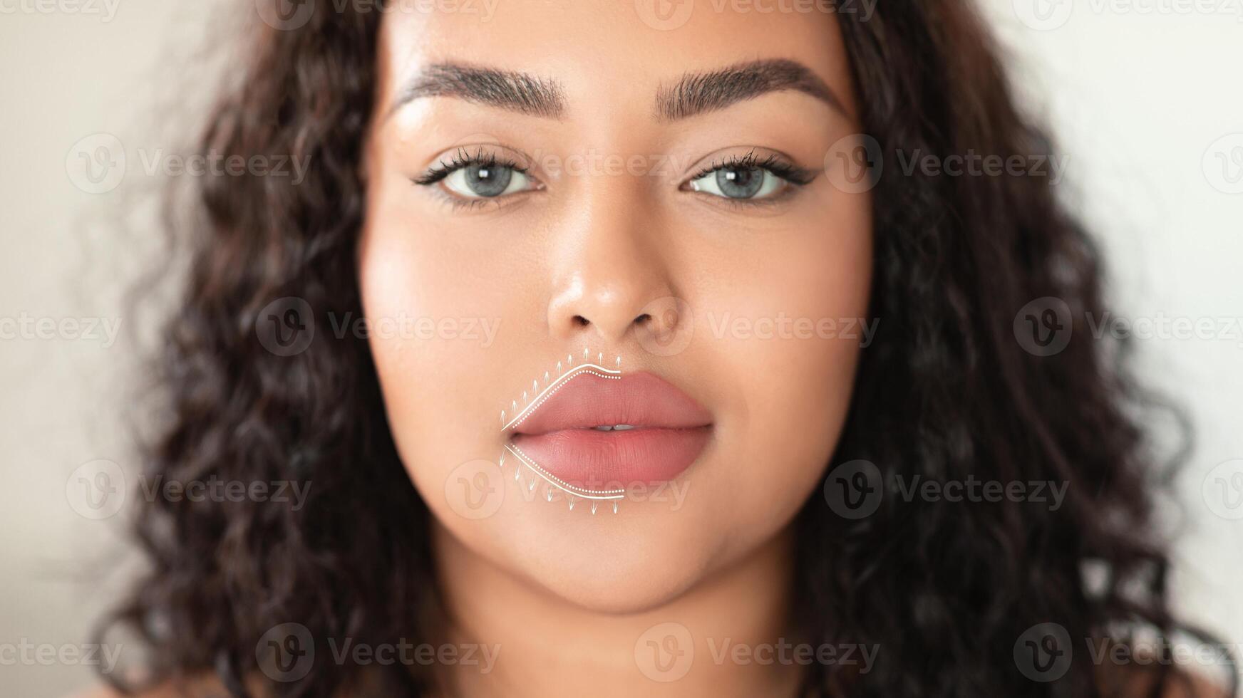 A woman enjoys a soothing facial massage aimed at anti-aging and skin rejuvenation. She relaxes in a serene atmosphere, enhancing her beauty with effective skincare practices. photo
