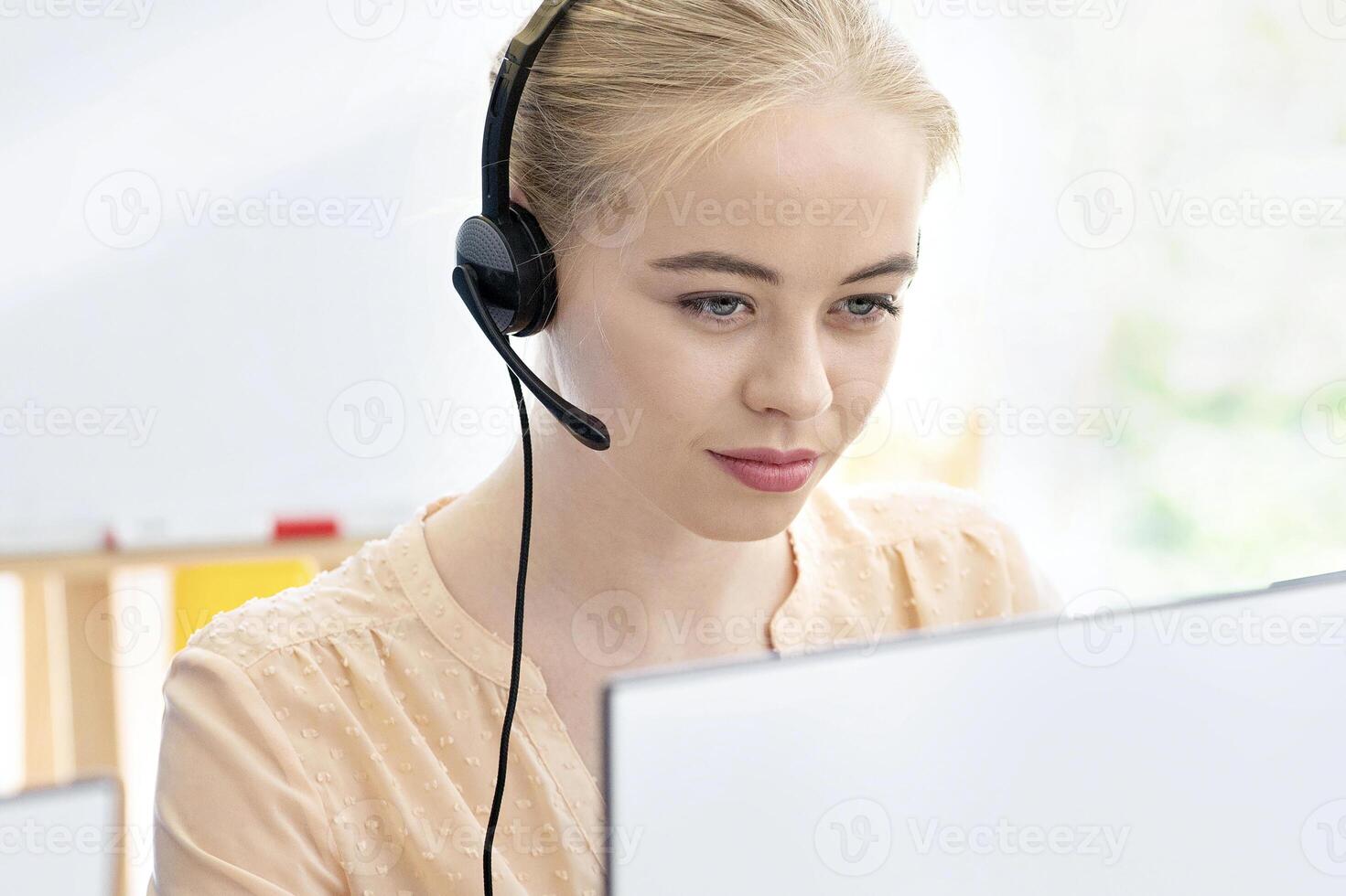 Young tech support operators at work in contemporary call centre. Millennial hotline agents using computers at office, consulting clients, selling goods on phone. Telecommunications concept photo