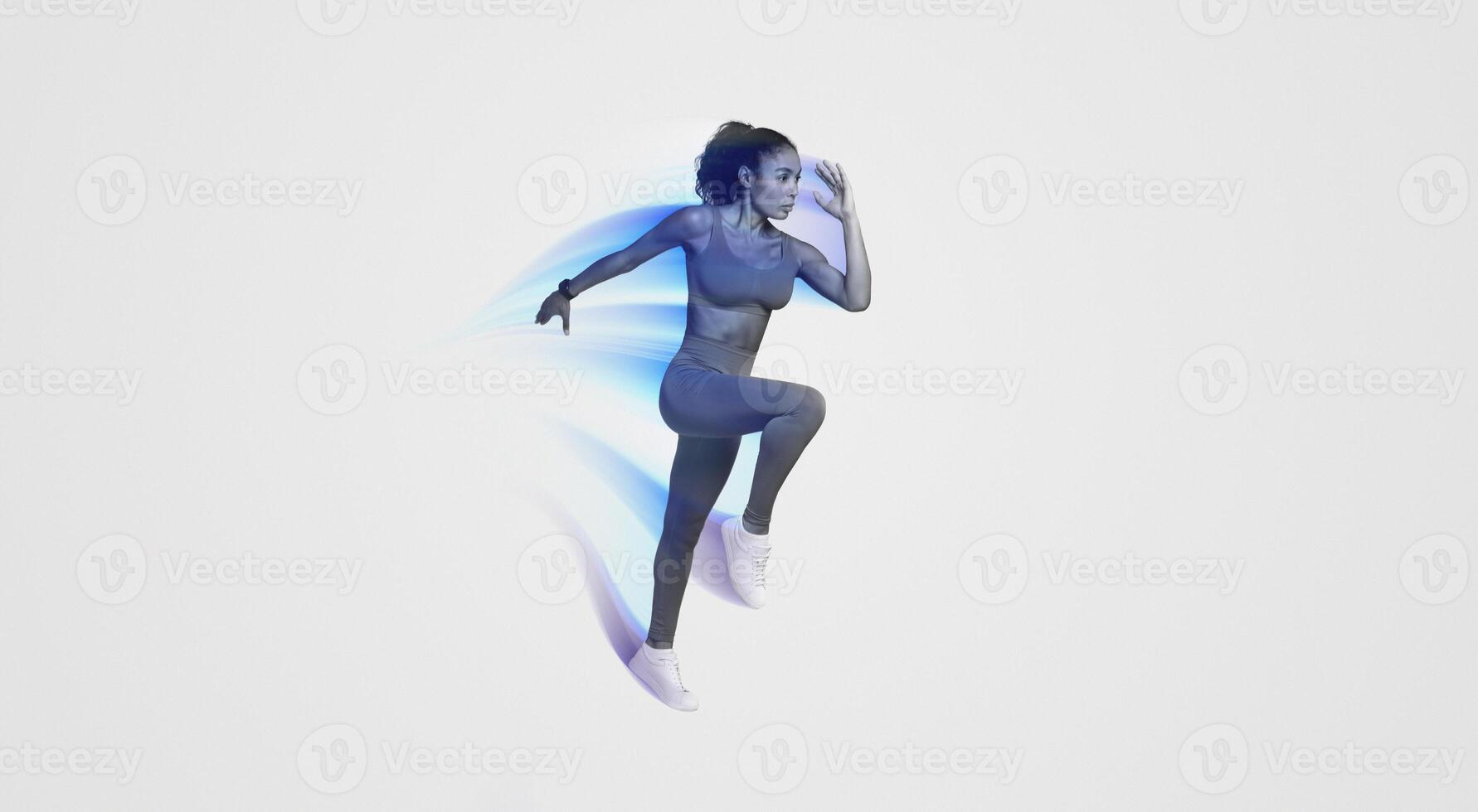 Athletic African American Lady In Fitwear Jumping Exercising During Training Over Pink Studio Background, Full Length, Side View Shot. Sport Motivation And Fitness Workout Concept photo