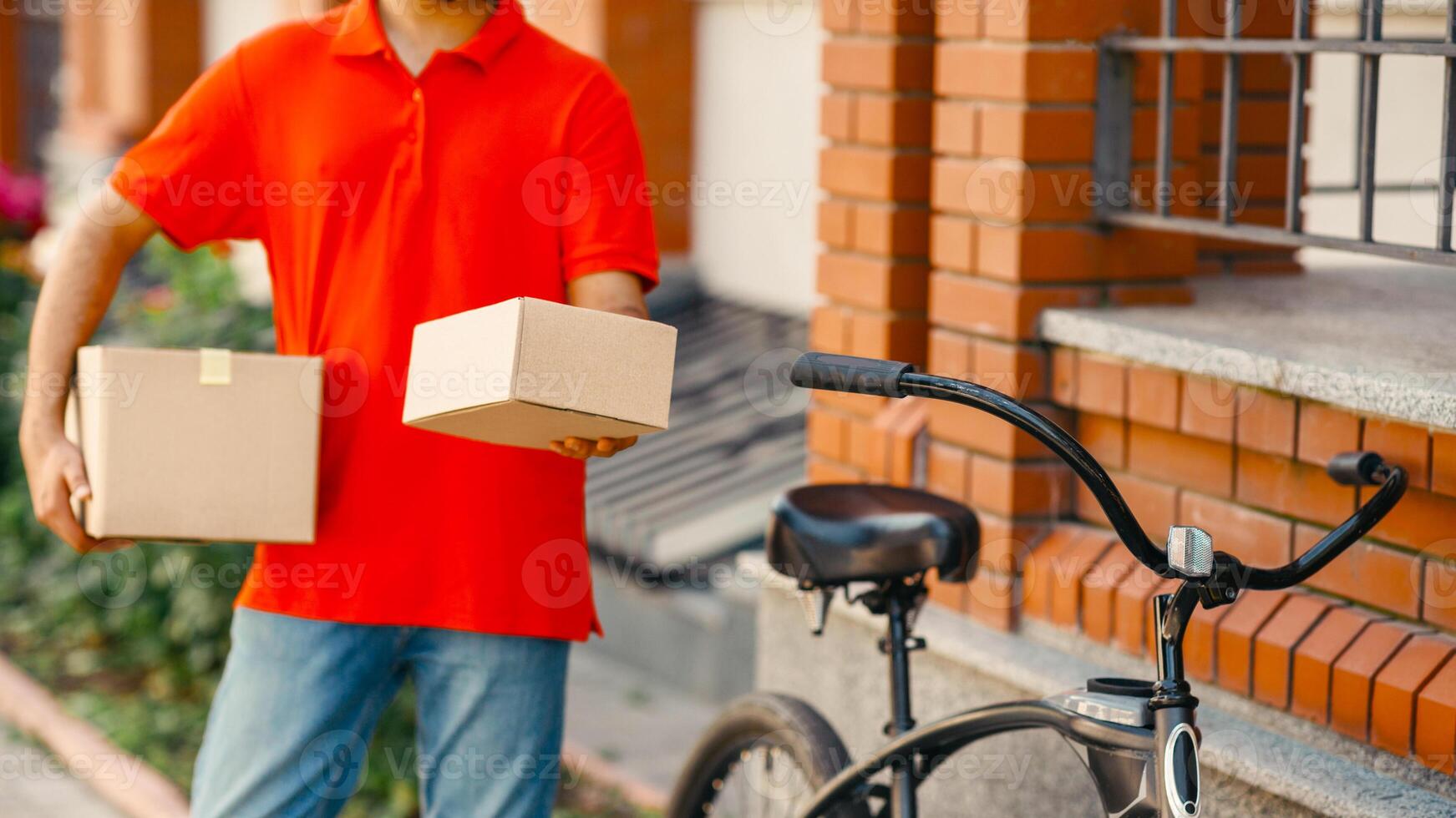 Delivery of goods to door of house. Client received parcel from courier with bicycle on street, outdoors, cropped photo