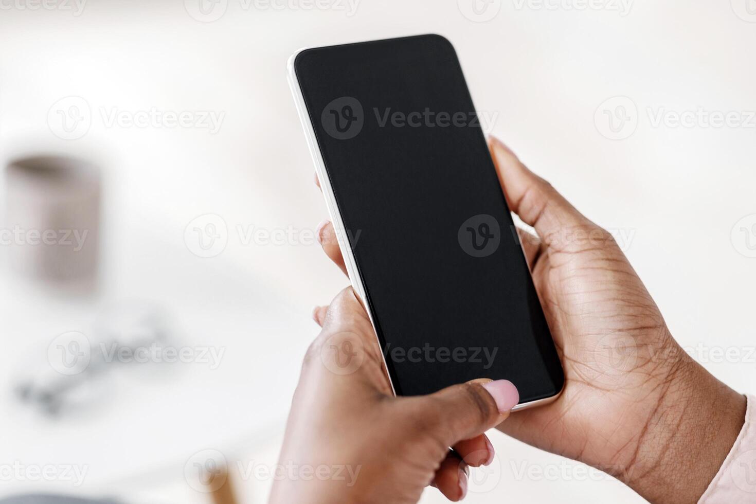 Mockup image of smartphone with black screen in hands of unrecognizable black woman, closeup photo