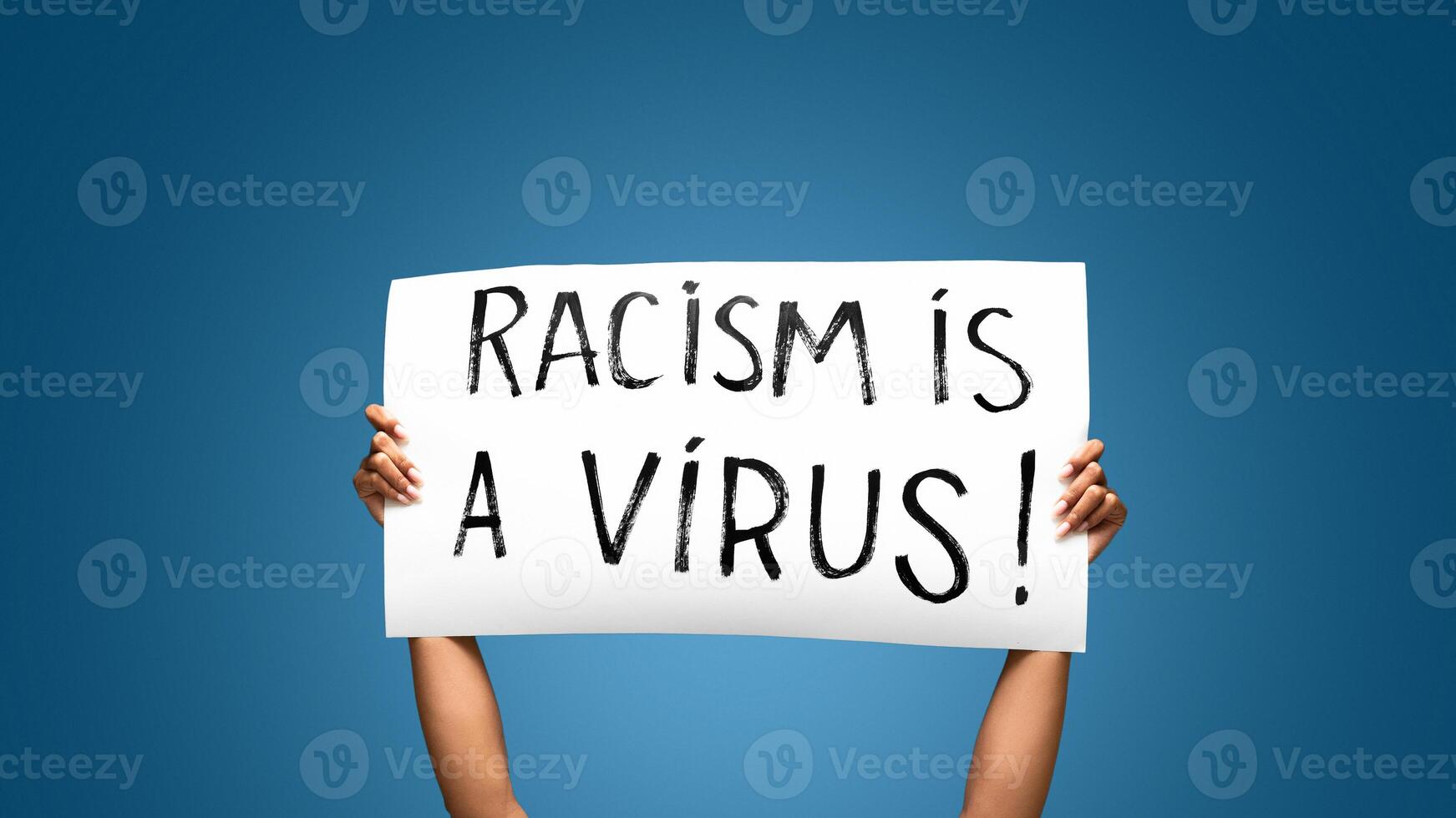 African american girl holding banner with text Racism is a Virus as protest to violence and discrimination to certain race photo