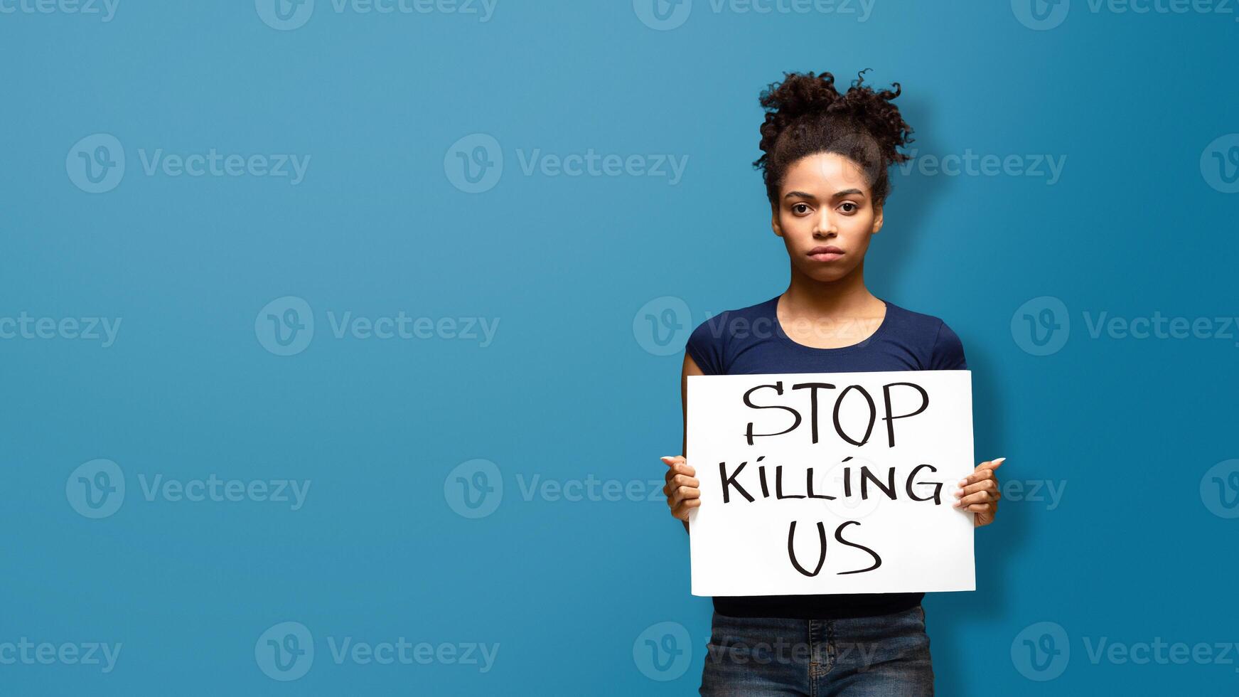 Stop Killing Us. African american woman standing with protest banner about human rights of black people in America. photo