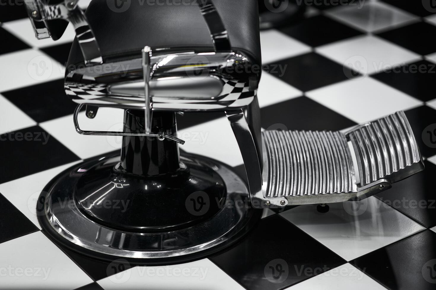 Vintage barber chair with checkered floor in a classic styling salon photo