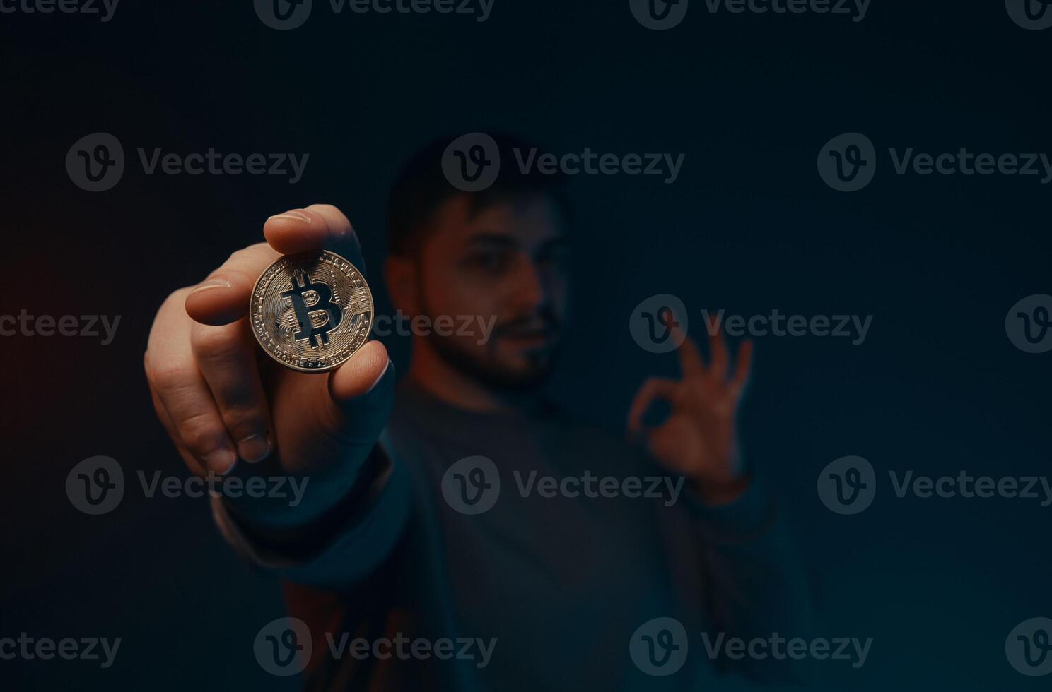 Bitcoin in your hands. New currencies of the future. photo