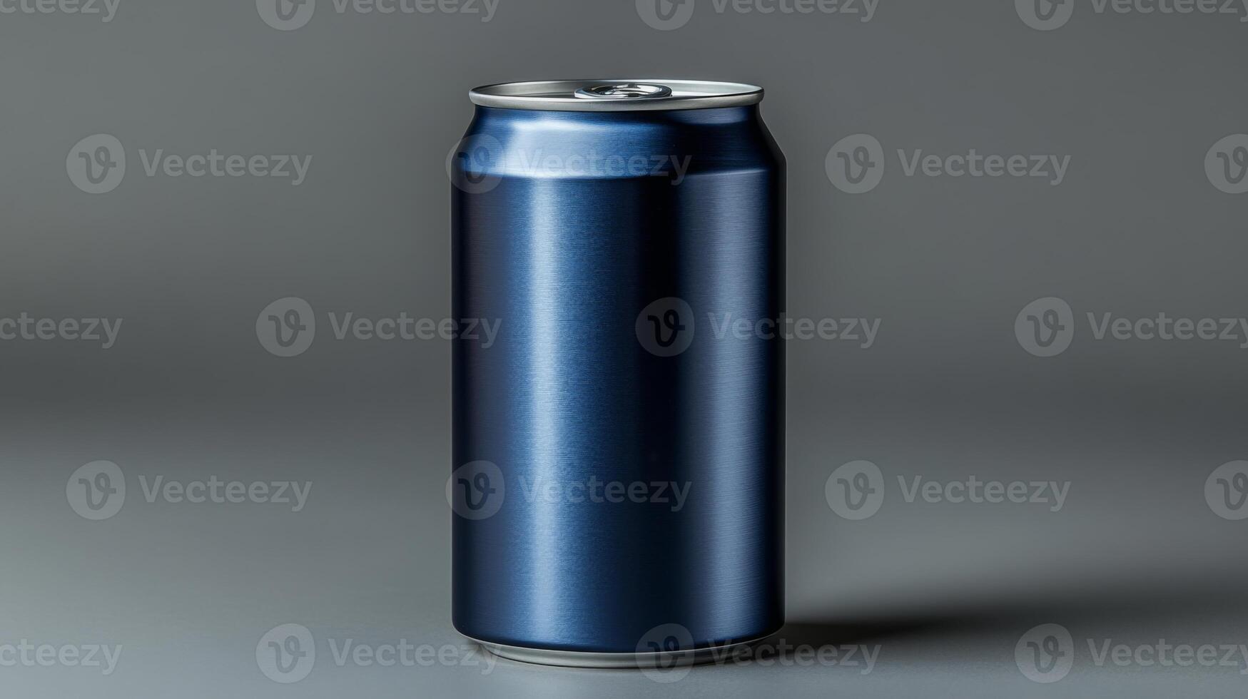 A metallic blue beverage can stands upright on a smooth gray surface, illuminated by soft lighting that highlights its sleek design and finish, reflecting a modern aesthetic. photo
