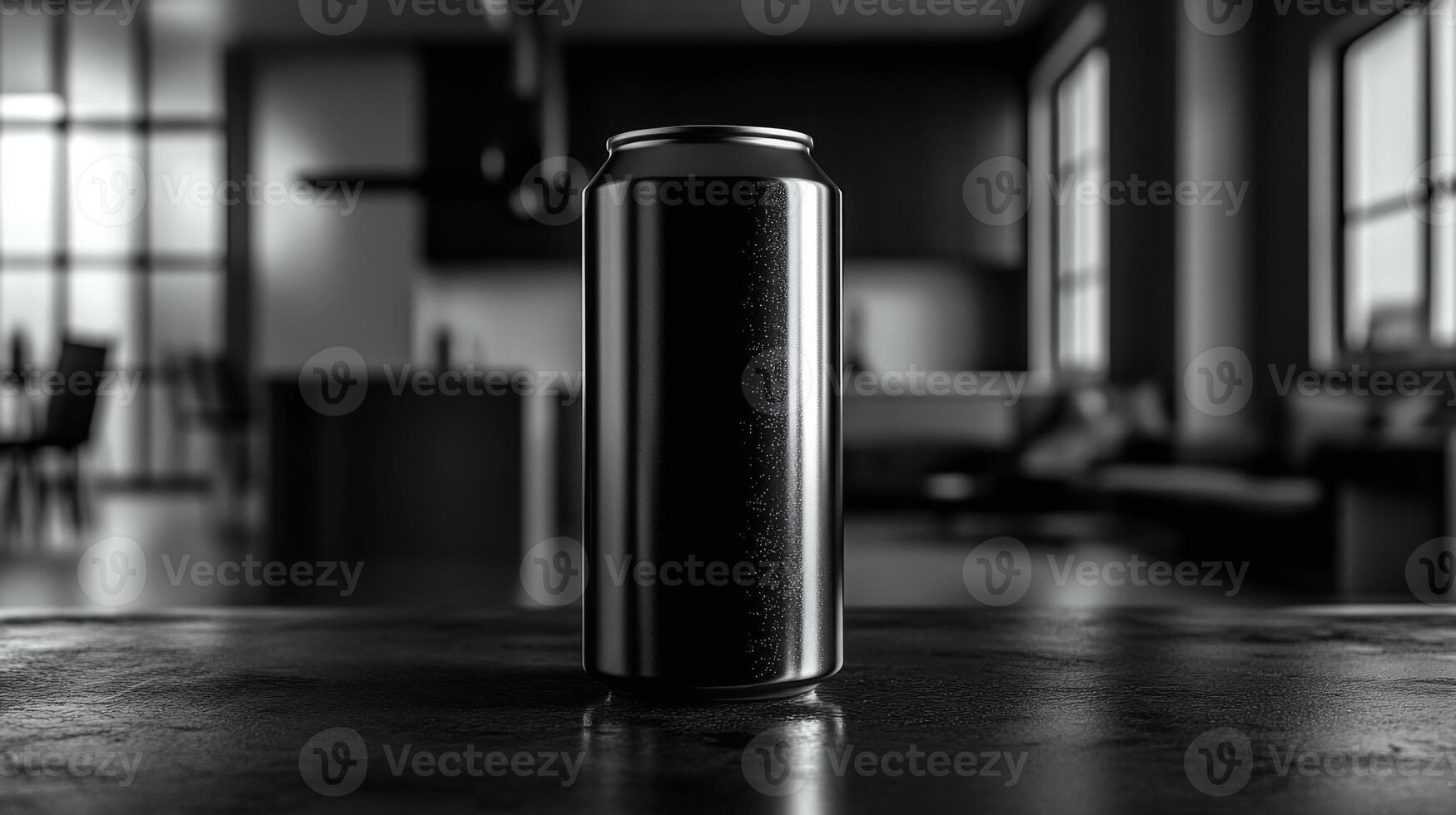 A black beverage can is centered on a countertop, highlighted against the minimalist backdrop of a contemporary kitchen with soft afternoon light streaming through large windows. photo