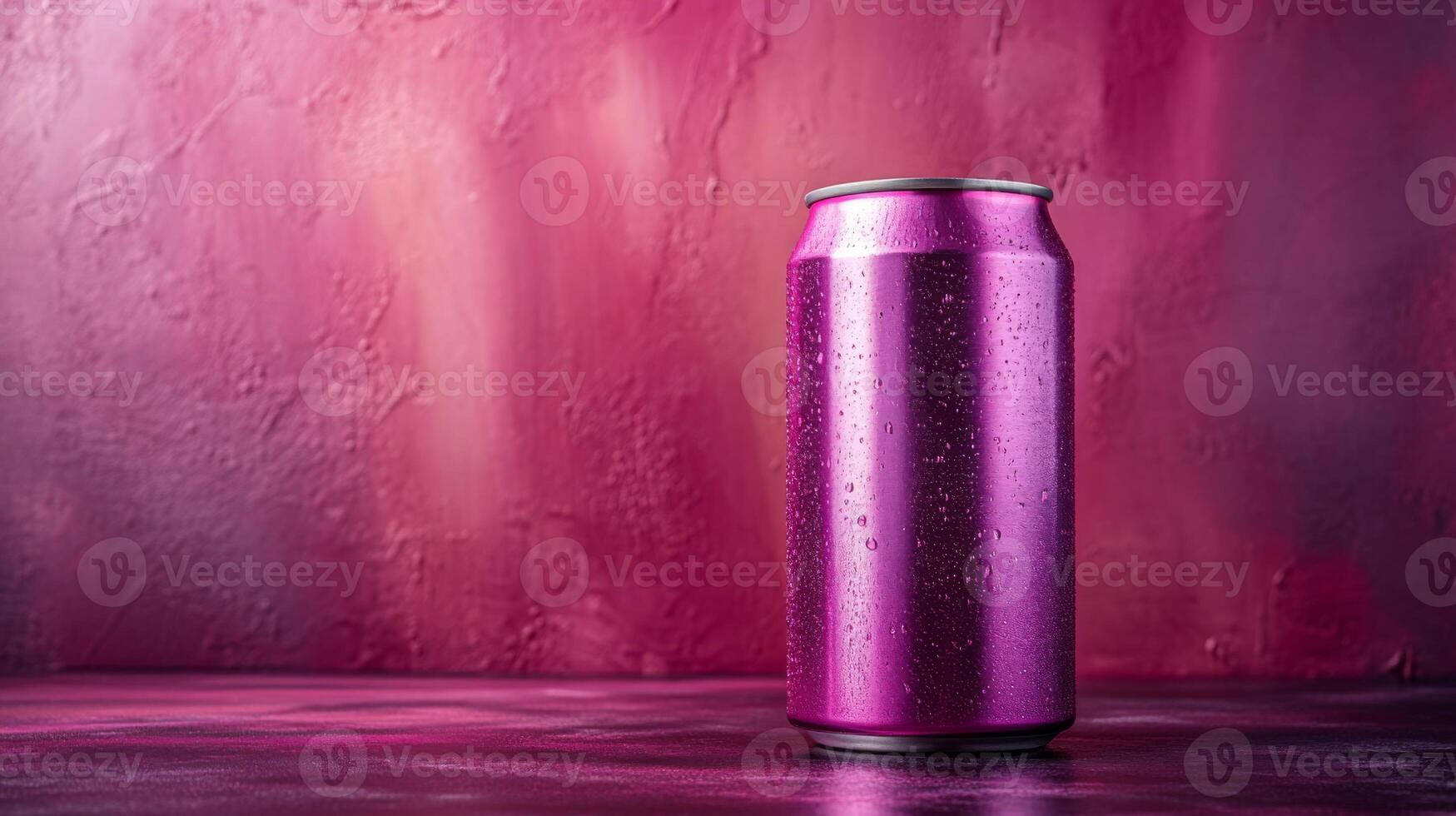 A sleek can in vibrant pink sits against a textured background in similar shades. Water droplets adorn its surface, creating a refreshing appearance in this artistic setting. photo