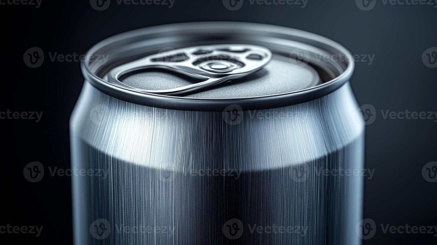 A shiny metallic beverage can is shown closely, highlighting the pop top and smooth surface under soft lighting, creating a sleek appearance. photo