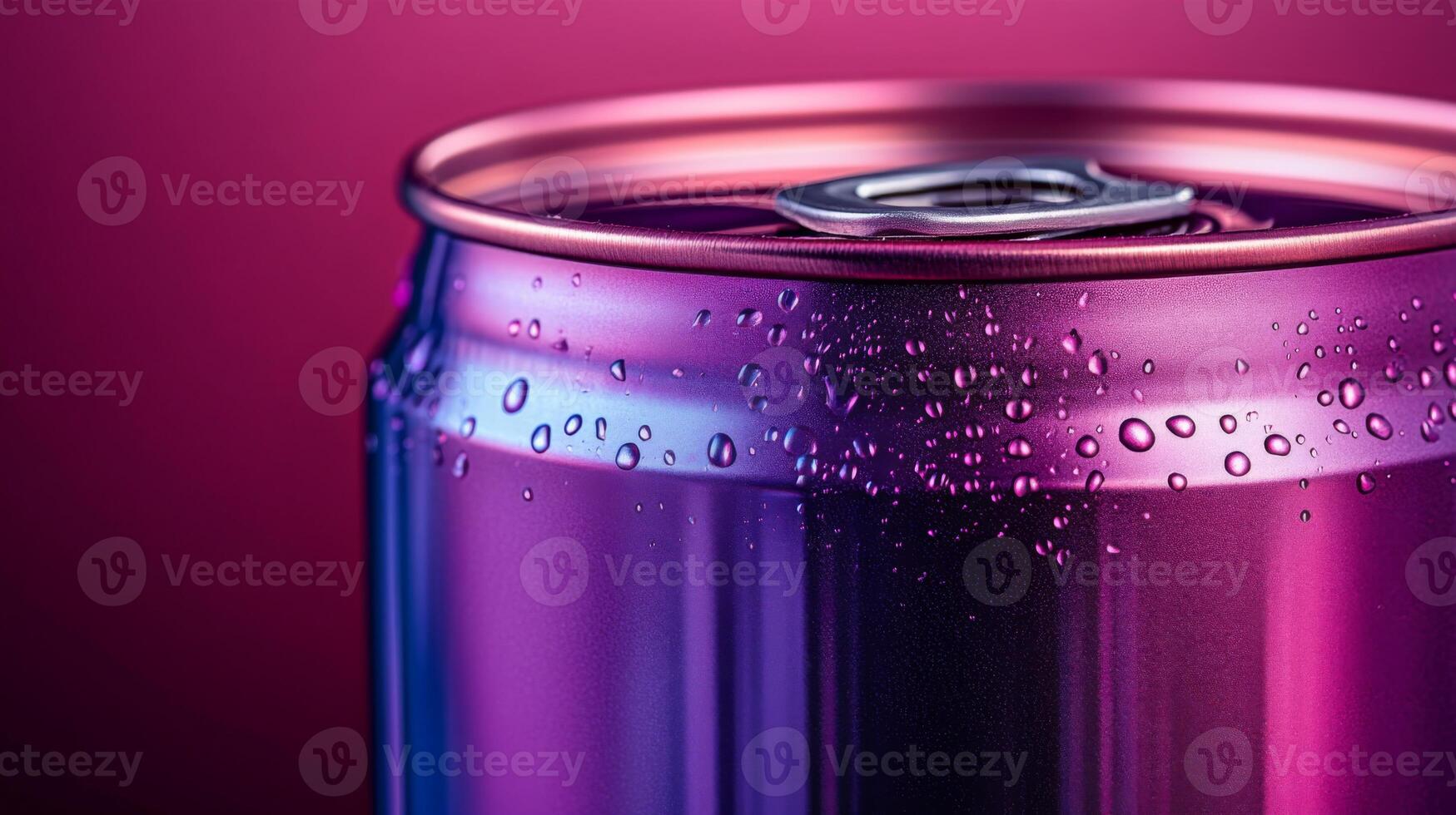 A close-up view of a chilled beverage can displaying vibrant colors and glistening droplets of water on its surface. The background enhances its refreshing appeal. photo