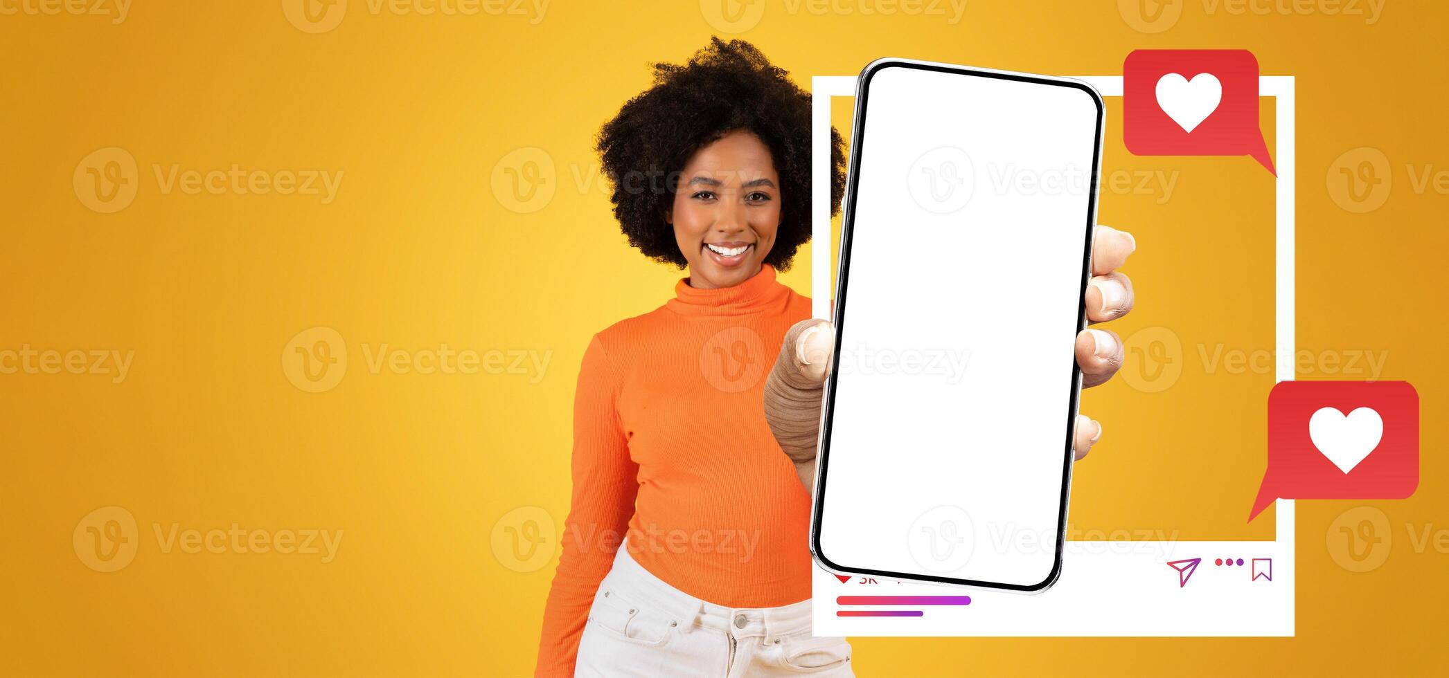 A cheerful influencer holds a blank smartphone in front of her, ready to connect with followers. The bright yellow background highlights the exciting social media environment and messaging activity. photo