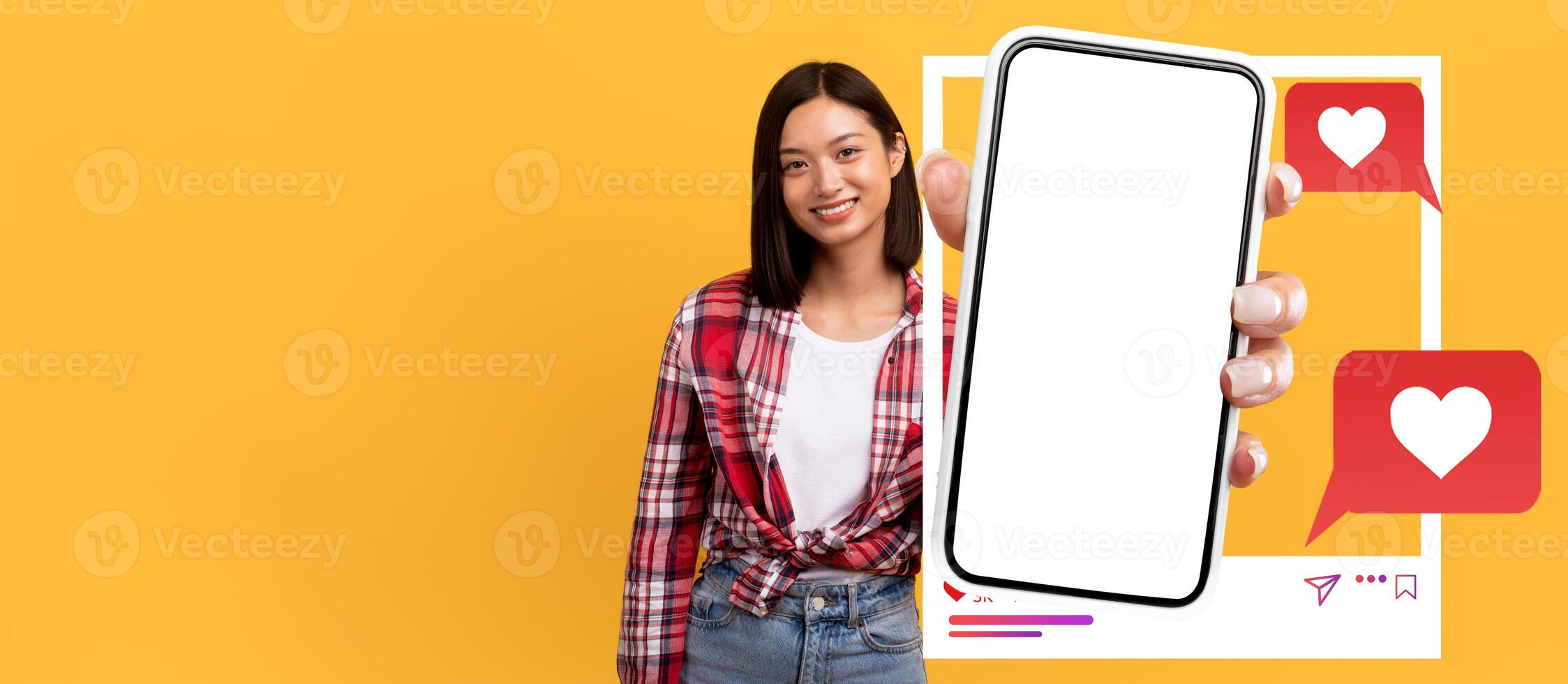 An influencer holds a smartphone with a blank screen against a vibrant yellow background. Chat bubbles and heart icons enhance the social media vibe, emphasizing online interaction. photo