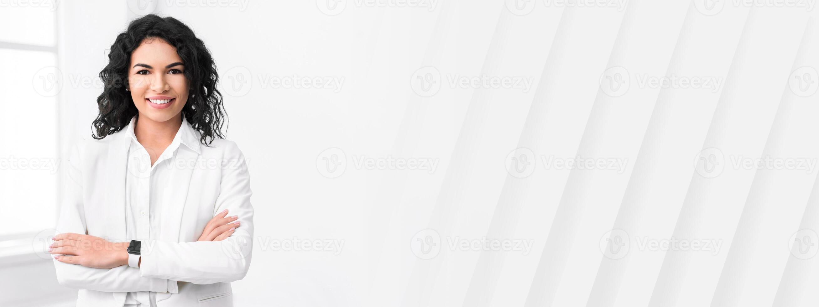 Confident Businesswoman. Happy mexican lady smiling at camera with crossed arms. Copy space photo