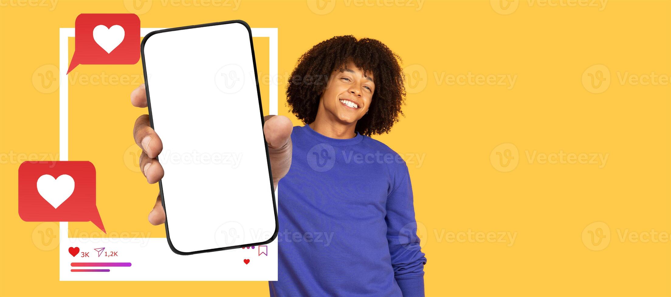 An influencer smiles while holding a blank smartphone screen, inviting interaction on a vibrant yellow background. Colorful chat bubbles indicate online engagement and messaging. photo