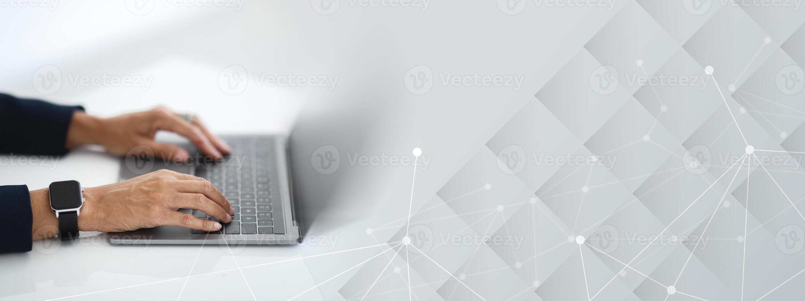 Closeup of unrecognizable middle aged businesswoman working on laptop, hands typing on computer keyboard while working in office, side view, cropped image photo