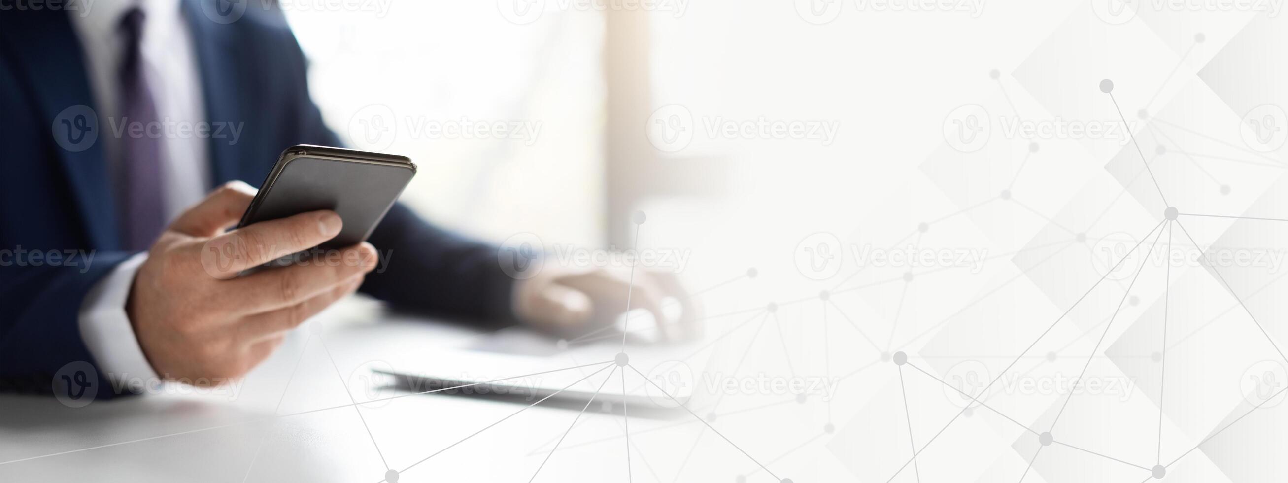 Unrecognizable Man Entrepreneur Using Smartphone And Working With Laptop In Office, Businessman In Suit Sitting At Desk, Browsing New App On Mobile Phone, Cropped Shot With Selective Focus, copy space photo