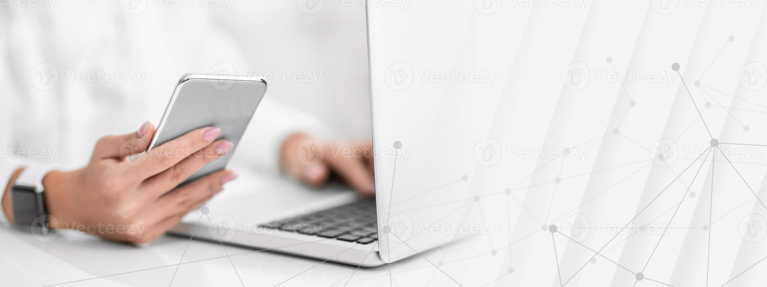 Modern Technologies. Closeup of woman using laptop and mobile phone, writing post. Free space photo