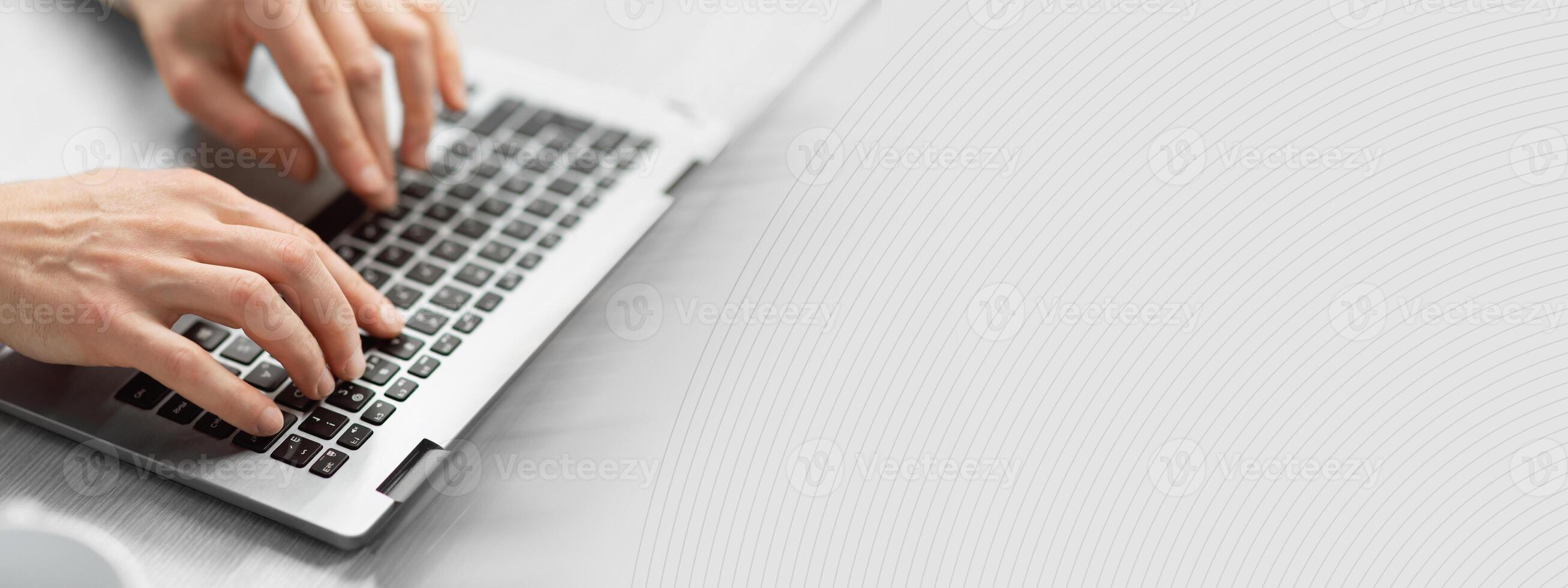 Close up selective focus on man hands typing on pc keyboard, cropped, side view. Middle aged businessman checking and sending emails to clients or assistant. Modern technologies and business concept photo