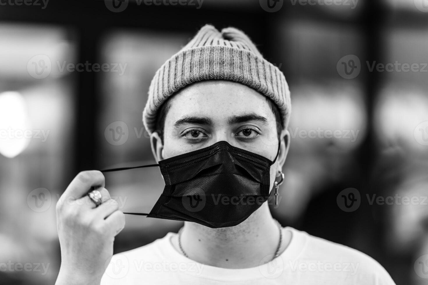 A man puts on a mask from a virus. Flu epidemic. photo