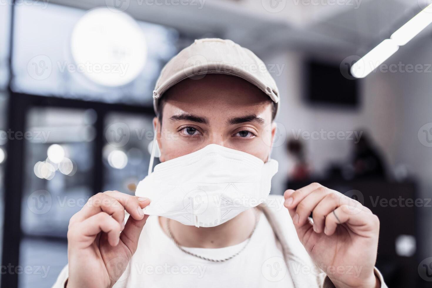 A man puts on a mask from a virus. Flu epidemic. photo
