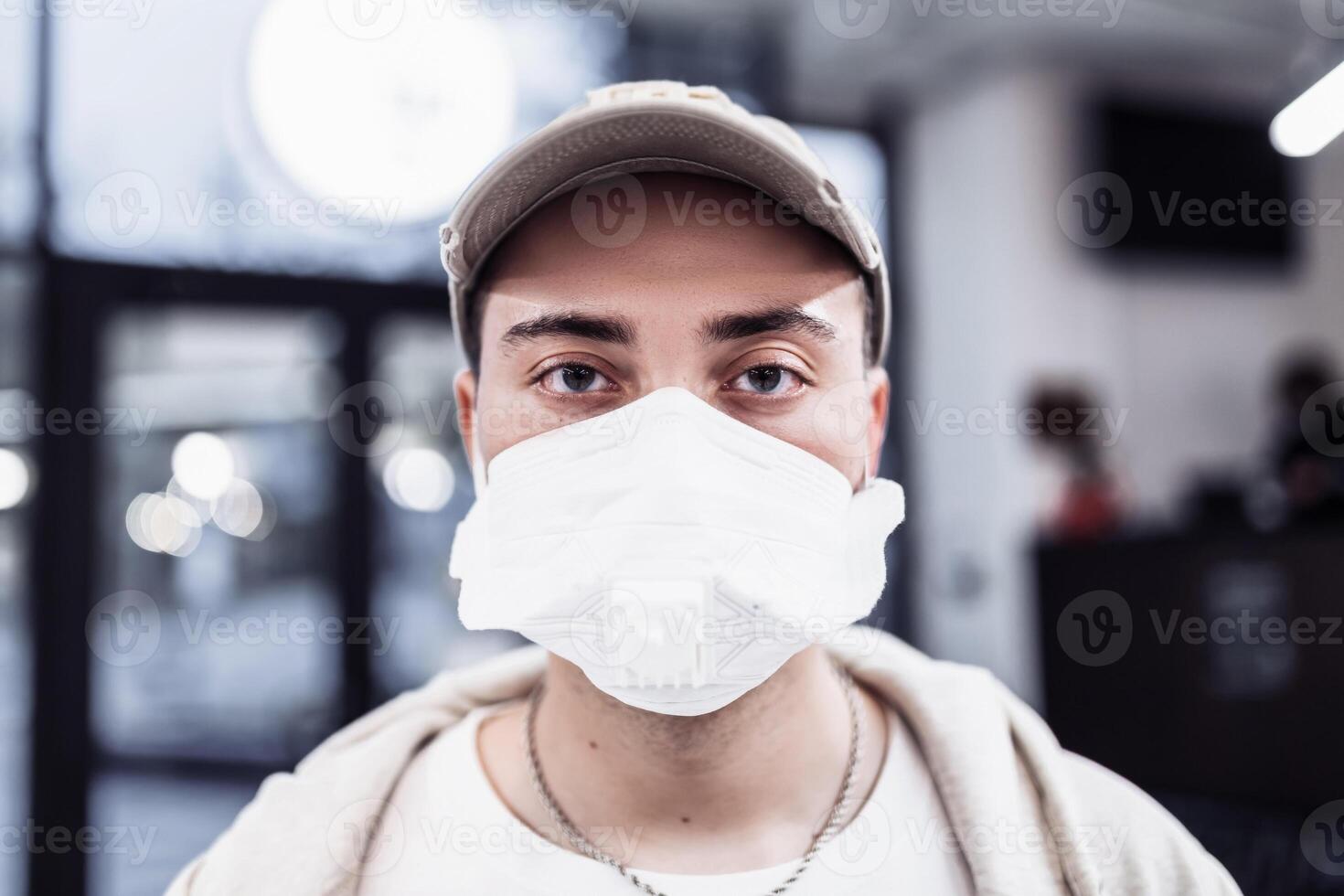 A man puts on a mask from a virus. Flu epidemic. photo