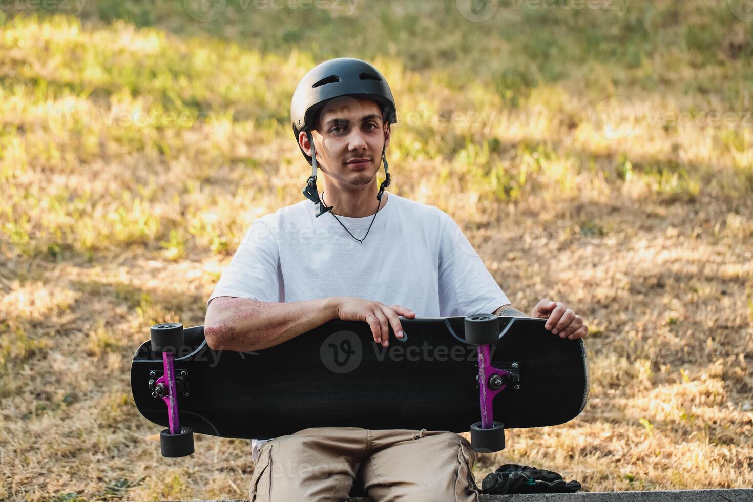 Portrait of a guy with a board in his hands. photo