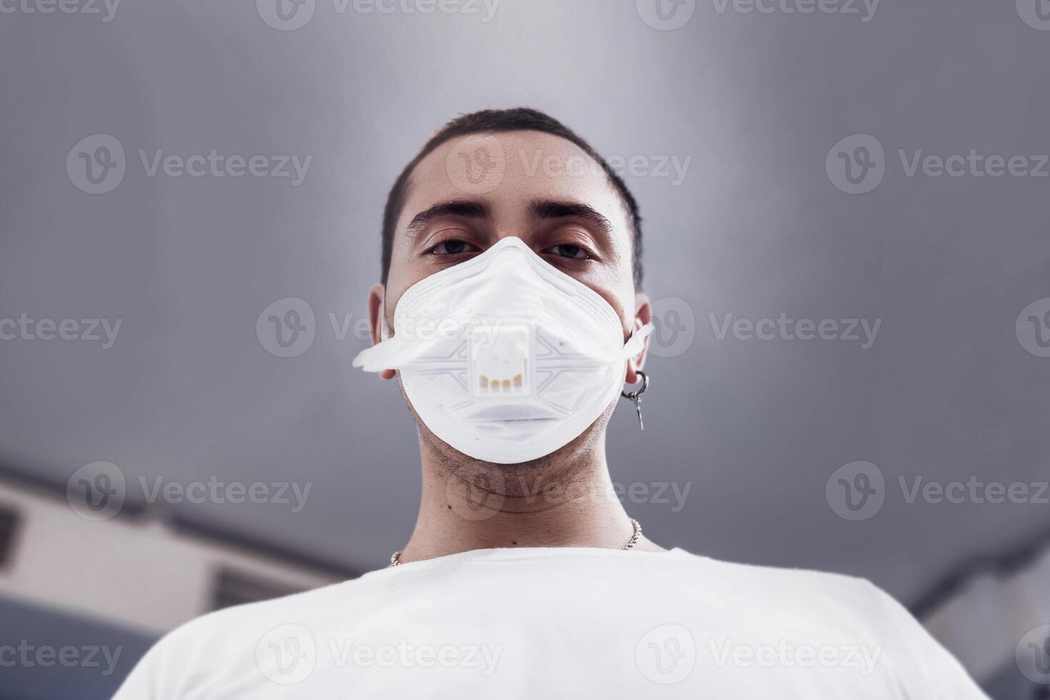 A man puts on a mask from a virus. Flu epidemic. photo