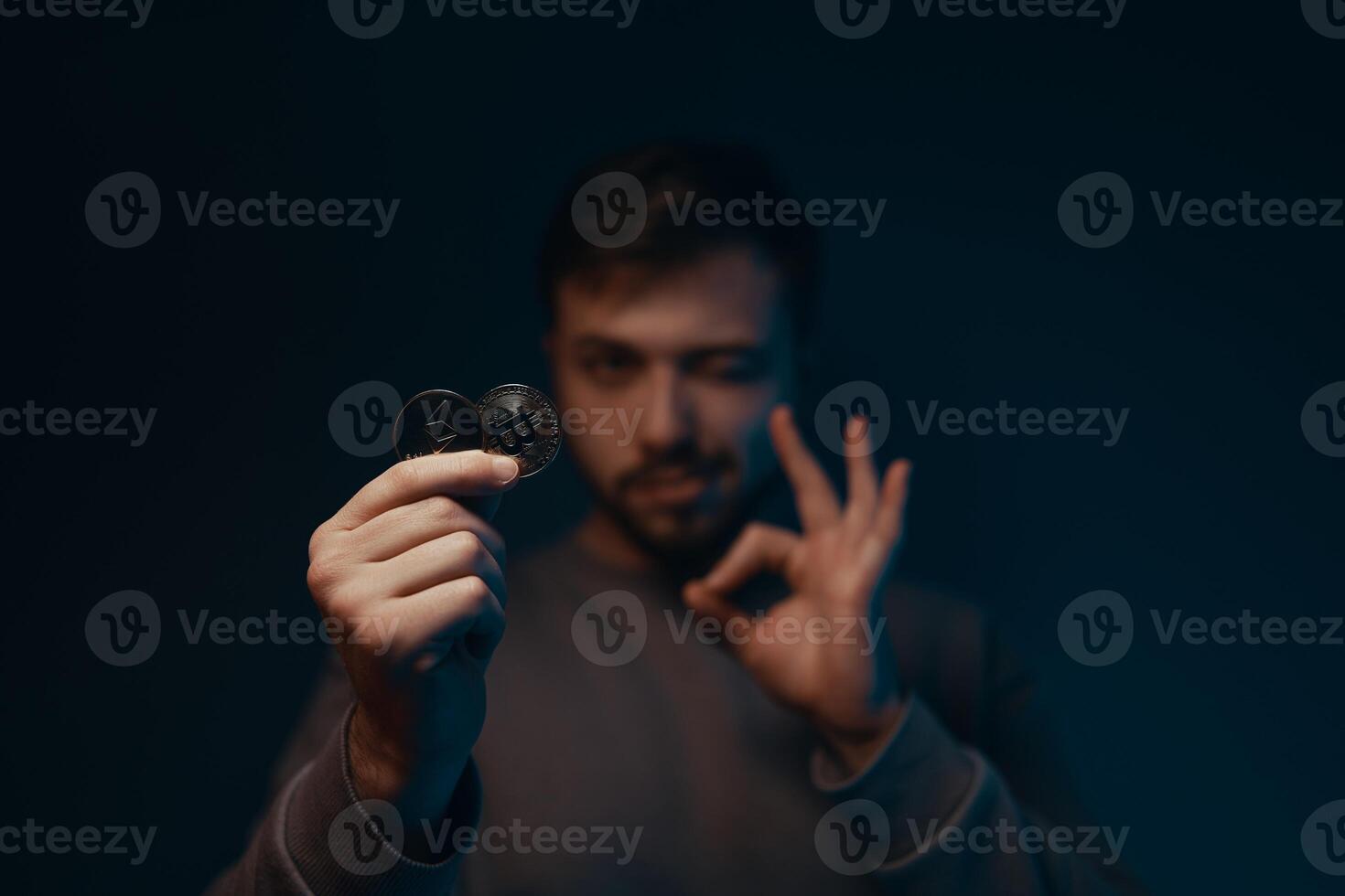 Man holding bitcoin. Financial ecosystem. The currency of the future. photo