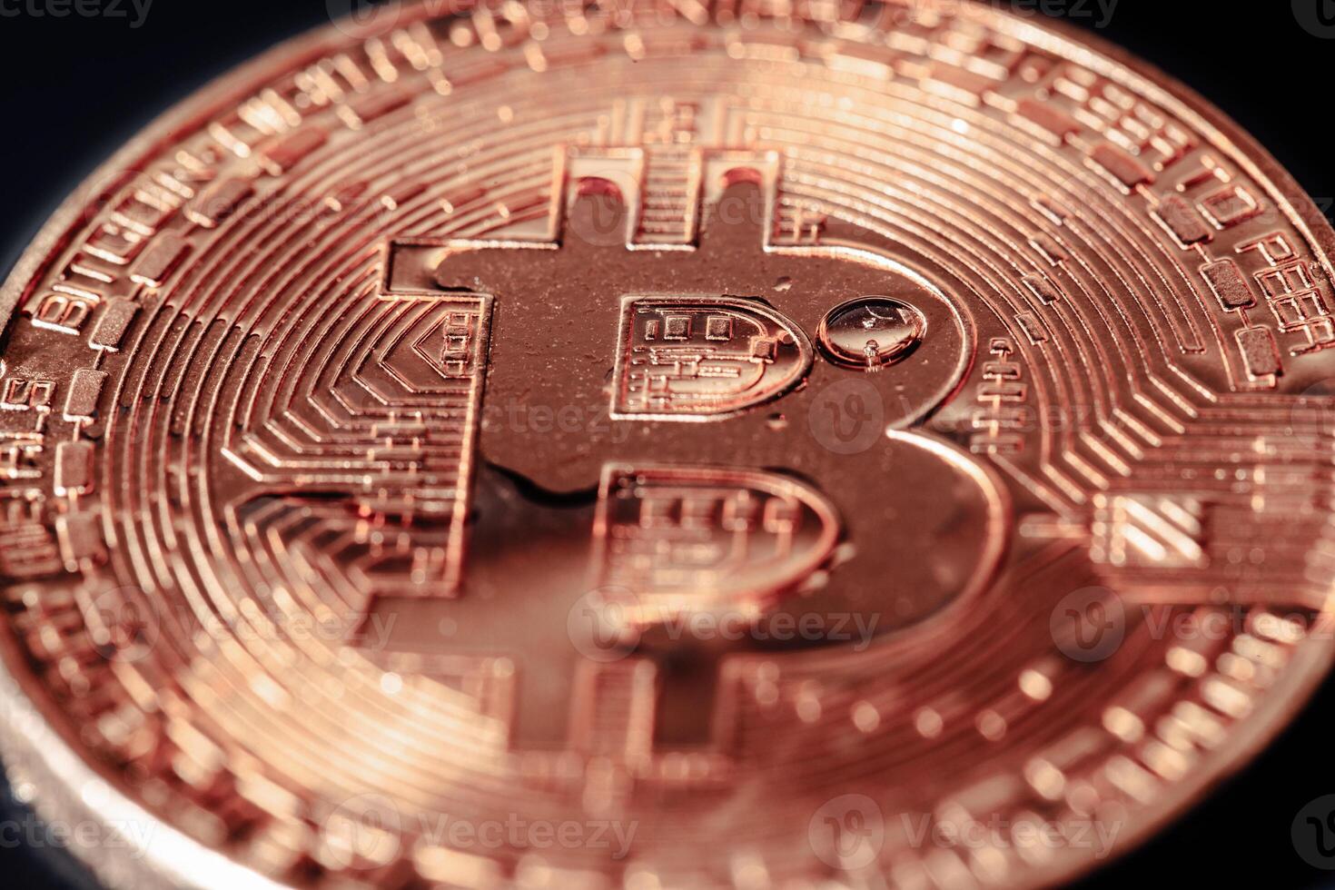 Bitcoin on black background. Cryptocurrency trading. Macro photo