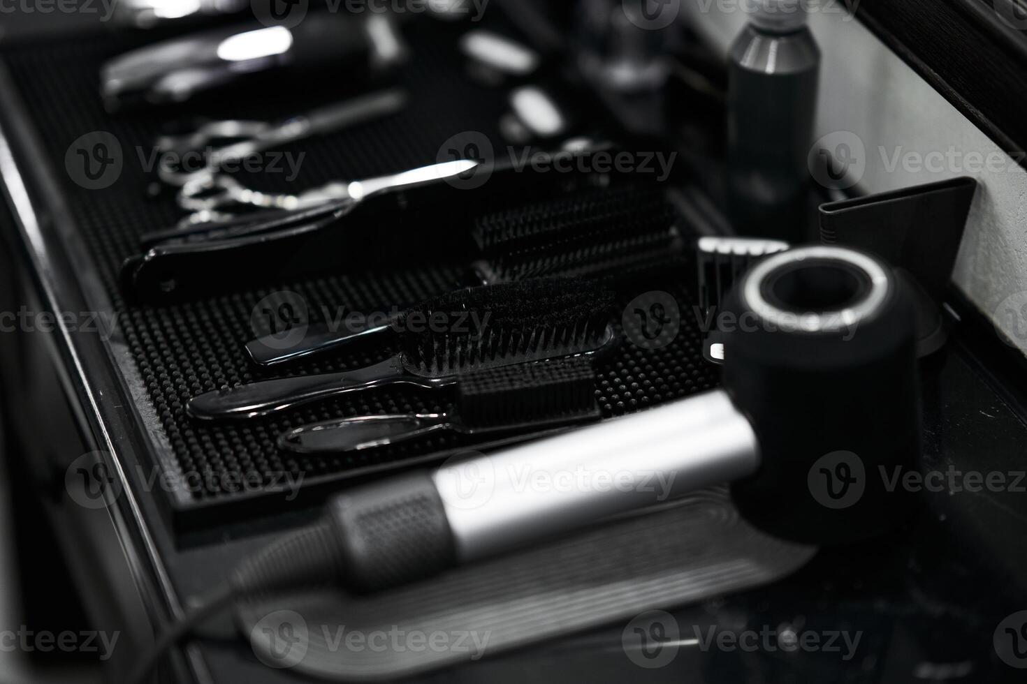 Tools arranged neatly on a salon counter ready for hairstyling services photo