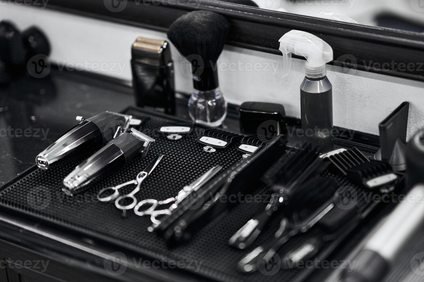 Tools and equipment arranged neatly on a barbers workstation for grooming tasks photo