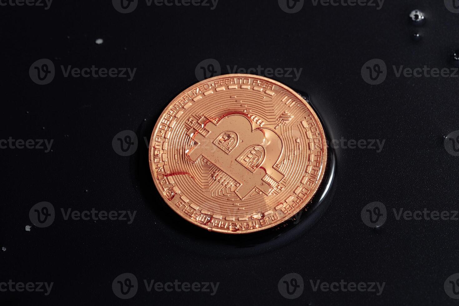 Bitcoin on black background. The world economic crisis. photo