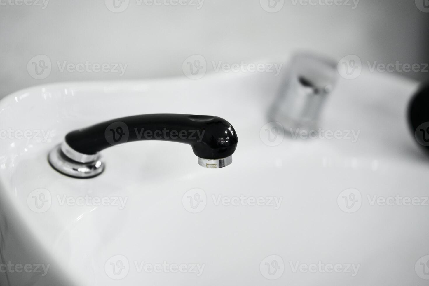 Modern black faucet design in a minimalist bathroom setting photo