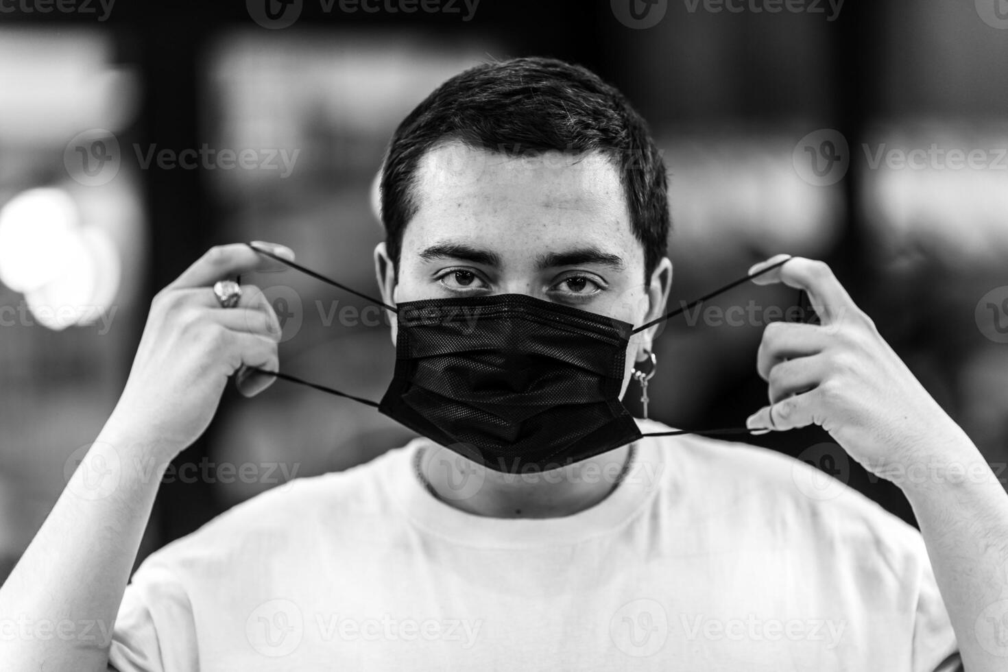 A man puts on a mask from a virus. photo